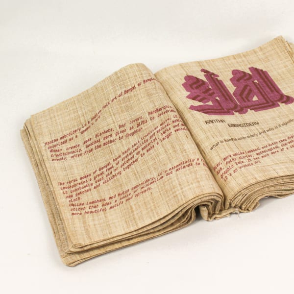 An open book with red text