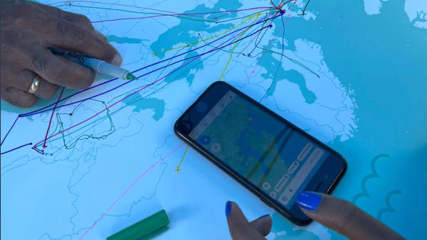 Mobile phone on map of the world.
