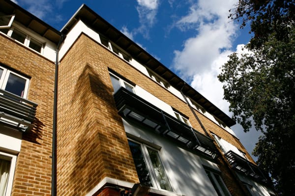 Exterior of Cordwainers Court, show 4 story building with a tree outside.