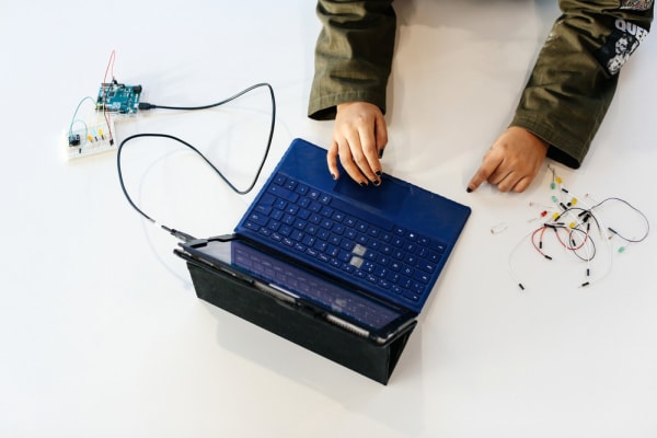 student wiring a computer