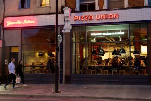 People sat in the window of a restaurant 