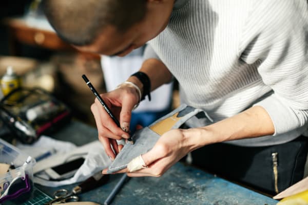 Boy working on a shoe 