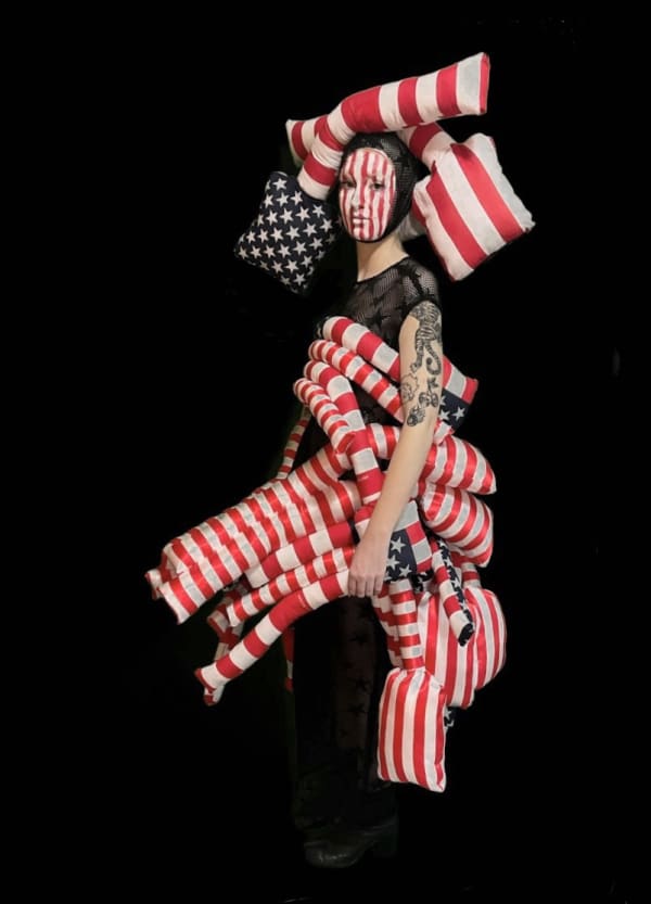 Figure wearing red and white striped outfit