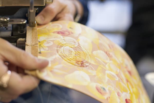 Workshop shot of leather handbag being made.
