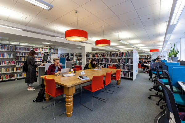 Students reading in the Library, John Princes Street building. Photography by Ideal Insight.