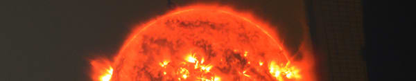 A close-up computer generated image of the sun featuring solar flares erupting from it's surface. 