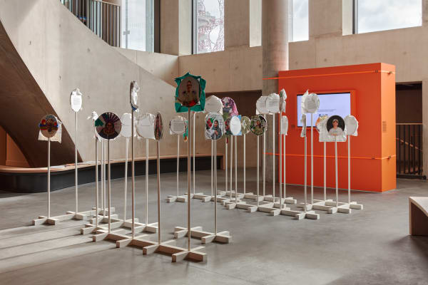 Circular portraits mounted on white frames