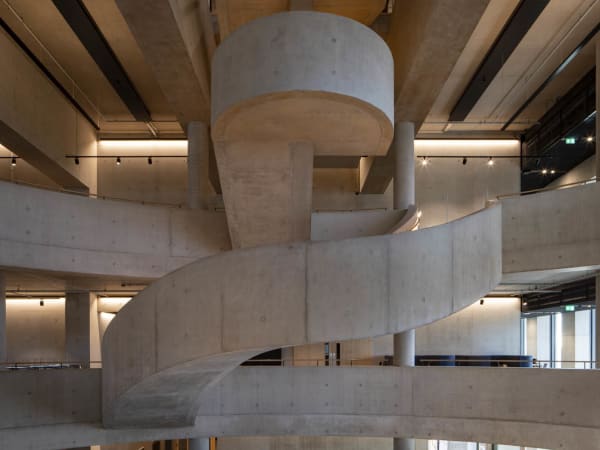 Interior architecture shot of poured concrete staircase at London College of Fashion East Bank