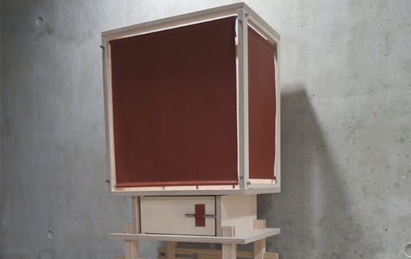 A wooden box with maroon panels