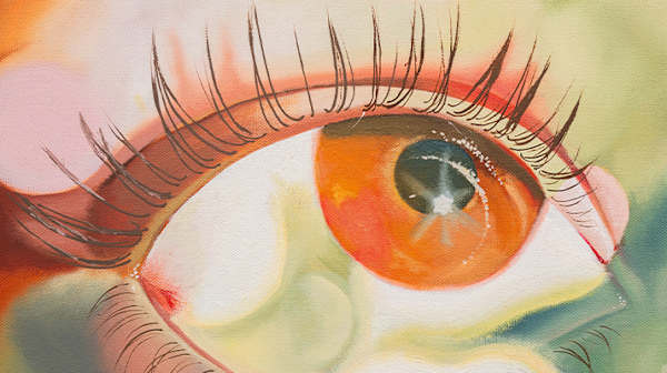 Close up of a painting of a multicolored eye and eyelashes