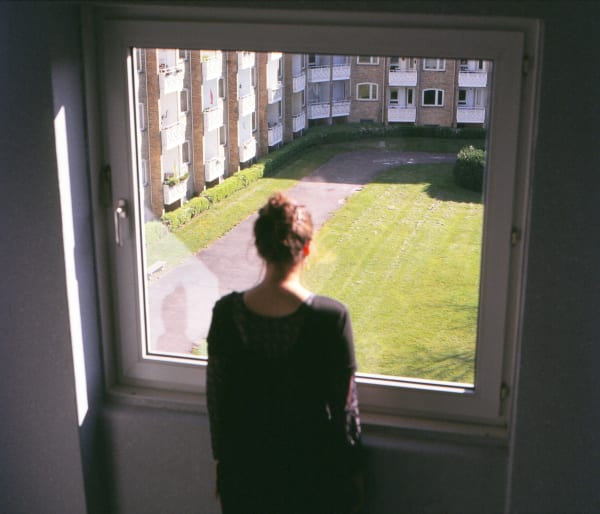 woman looking out of a window