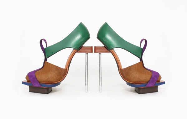 A pair of green, blue and brown shoes produced by a student at London College of Fashion