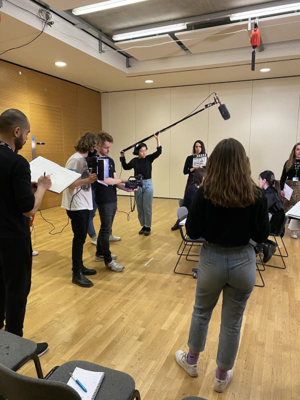 Students filming a scene 