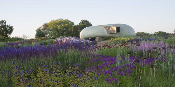 Photo of the Radić Pavilion at Hauser & Wirth in a field of purple flowers and grass