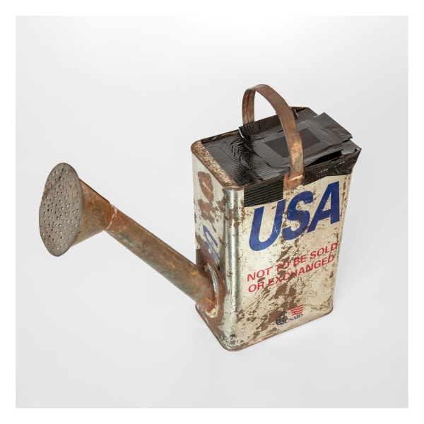 Oil can turned into a watercan, with the words USA on the side.