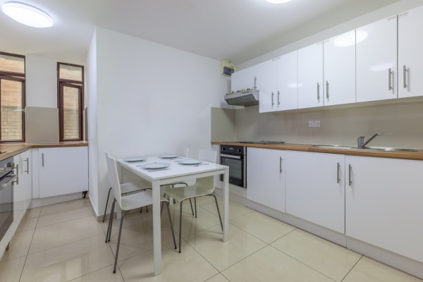 Shared kitchen example with sit down table space