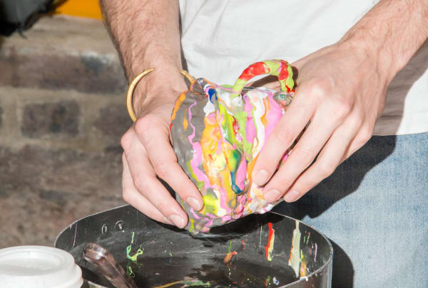 hands shaping a clay mug
