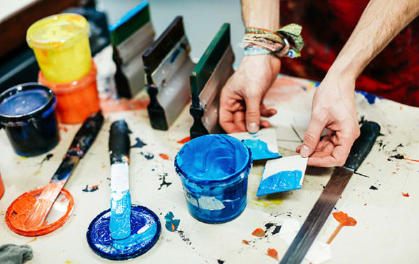 A student mixing ink in the Letterpress workshop.