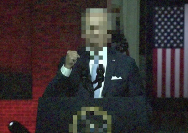 Image of blurred out president speaking
