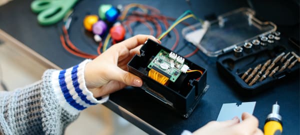 Close up of student working with technical equipment