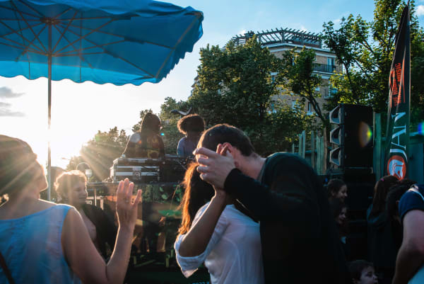 Festival attendees dance to Nzinga Sounds, one of the UK’s longest running female sound systems at the Fête de la Musique concert at the Palais de la Porte Dorée Paris, curated and produced by Karina H Maynard