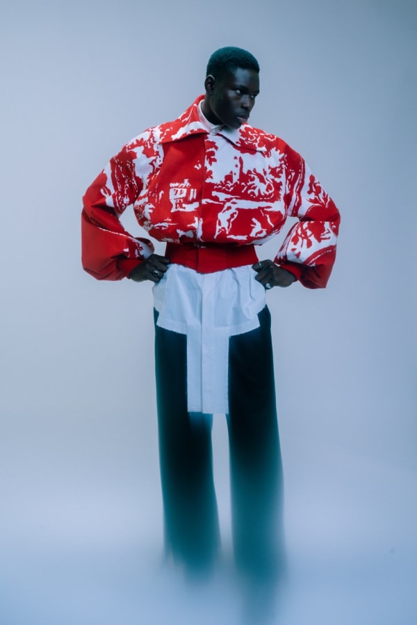 Male model in red and white cinched jacket.