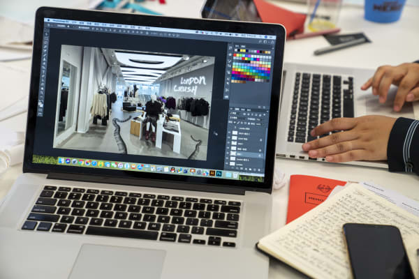 Visual Merchandising Student Work on Laptop