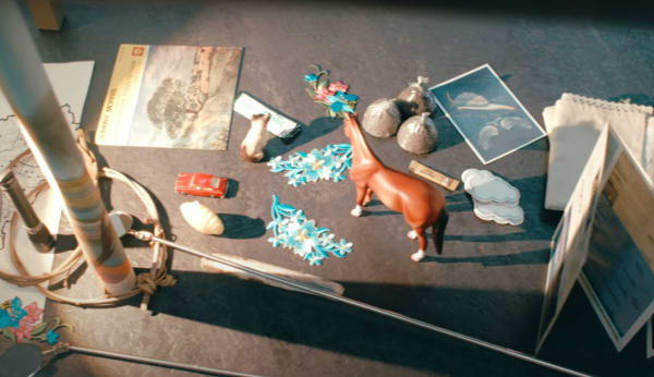 Lots of toys laid out on a concrete floor