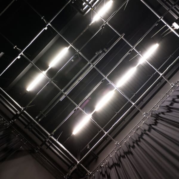 Photograph of large bright lights on the ceiling backstage of the Black Lab at Central Saint Martins