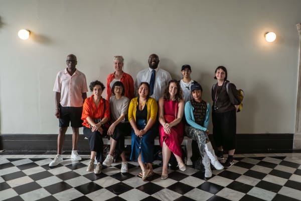 A group of people smiling at the camera