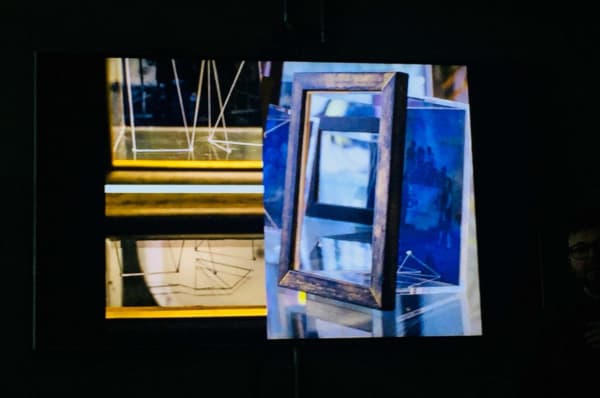 Abstract image of a small mirror in front of a table