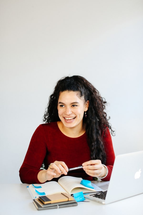 girl smiling at desk