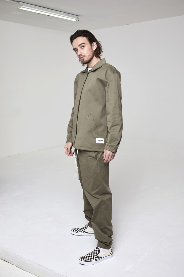 Man standing in khaki clothing