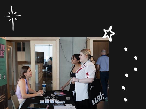Students speaking to staff at the Careers Fair 2024 at East Bank. Photography by India Mae Alby.