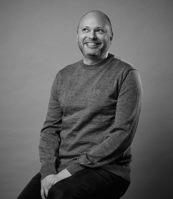 Black and white studio portrait of Peter Ainsworth