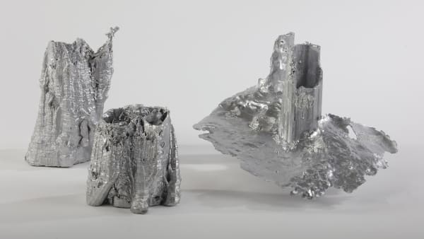 Silver sculptures of tree stumps