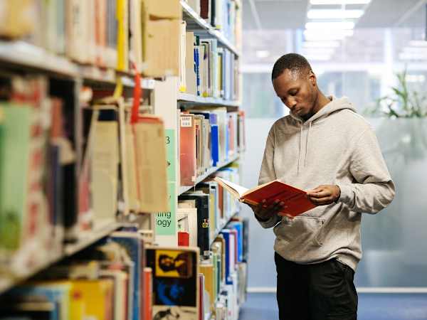 Student reading in the library London College of Communication