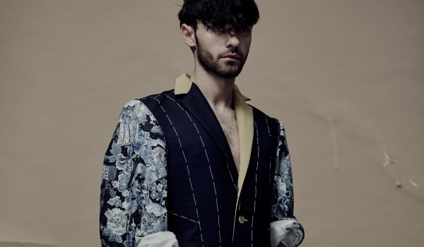 Male model in clothes visualising the tailoring process