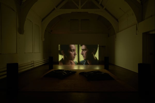 Dark room with cinema screen at front