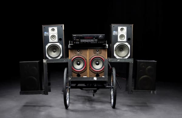 Three pairs of speakers mounted on a tricycle