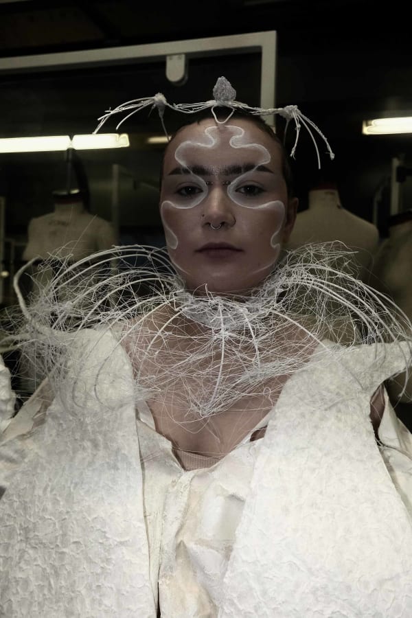 Portrait of person wearing ruff-like garrment