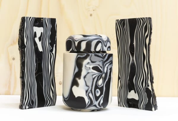 Vase and pot in striking black and white pattern