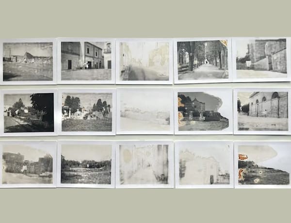 A series of black and white photographic experiments printed on square format paper