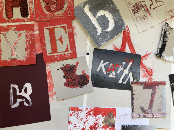 Handmade graphic prints of colourful letters.