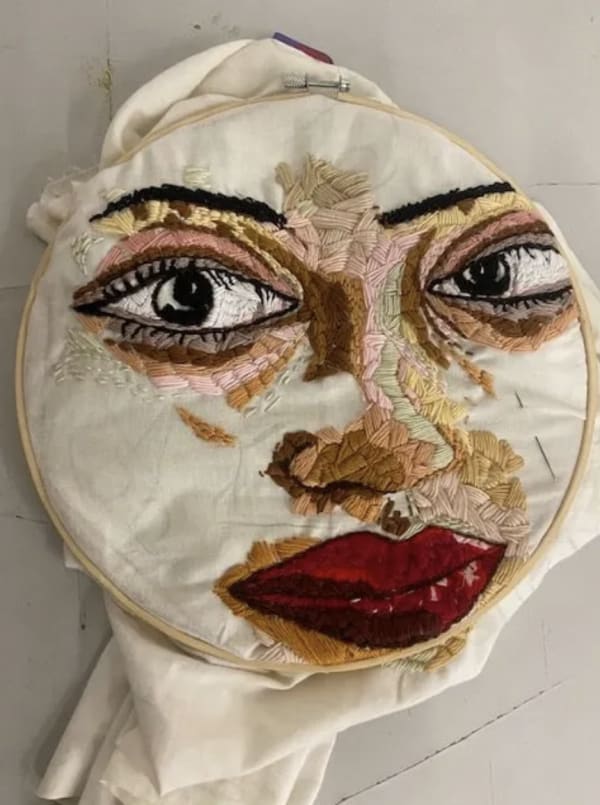 An embroidered face