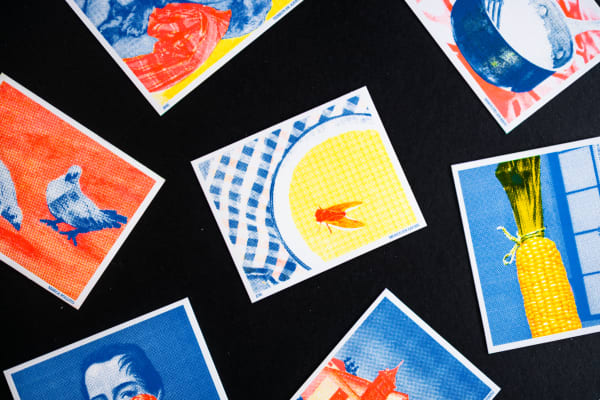 Collection of coloured images scattered on a black background