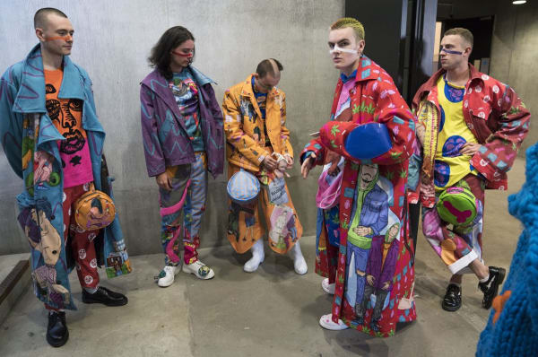 Models wearing brightly coloured clothes 