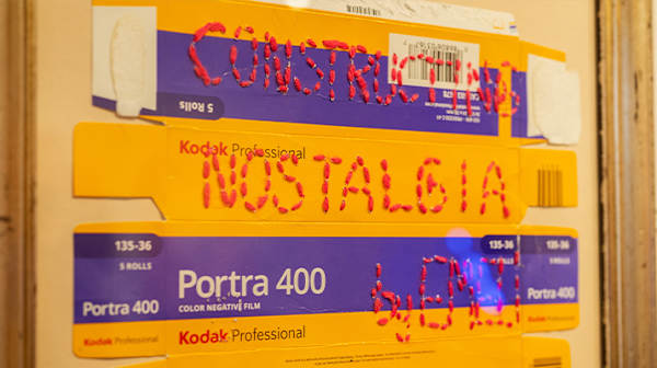 Stitching onto old camera cardboard box 