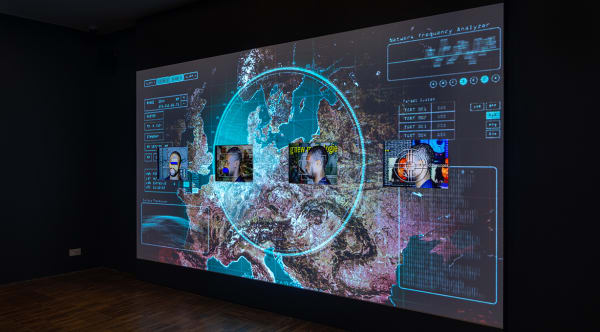 Photograph of a projected screen in a gallery space