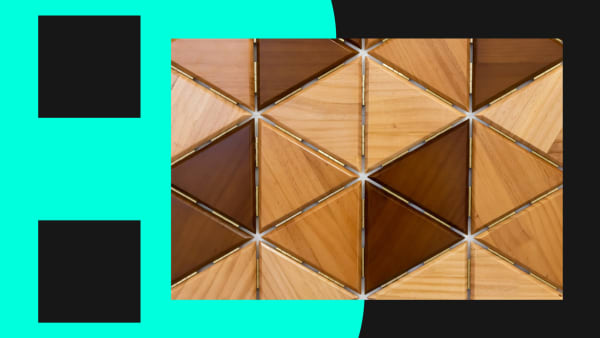 Triangular wooden shapes fitted together with hinges